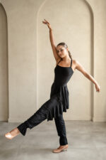 Dance knit pants with a soft waistband and decorative ruffle